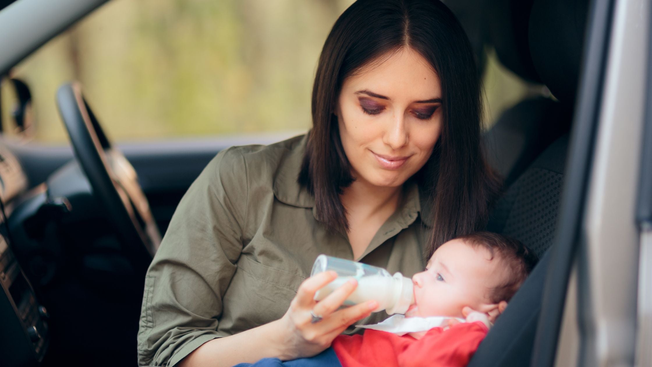 Mother feeding her baby ready to feed formula | Organic Formula Hub